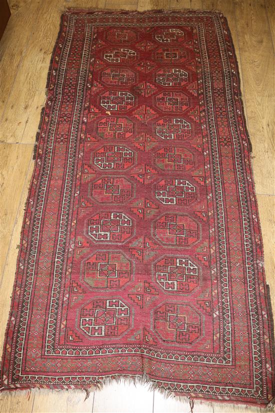 An Afghan ground rug 200 x 95cm